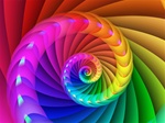 A coil of strong primary hues spirals into the center of this brilliant rainbow image. Great motif for a pride event!